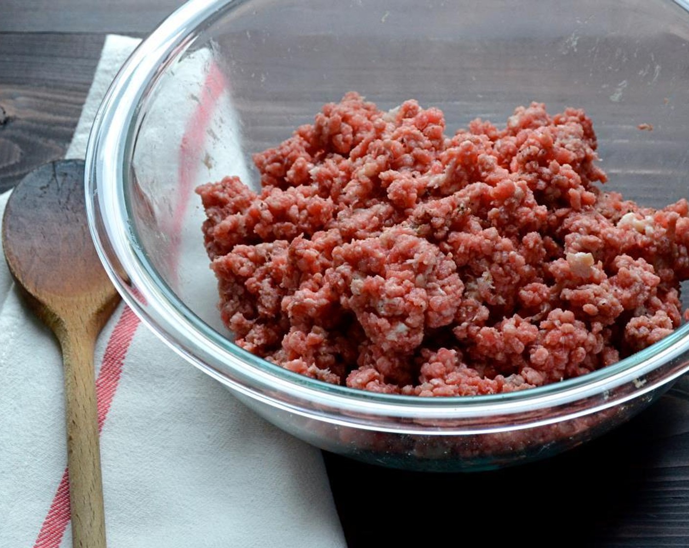 step 3 Place the Ground Chuck (1.3 lb) into a bowl and add the bacon, Kosher Salt (1/2 tsp), Ground Black Pepper (1/2 tsp) and Water (2 Tbsp). Fold the bacon and seasonings into the beef to blend evenly - but try not to overwork the meat.