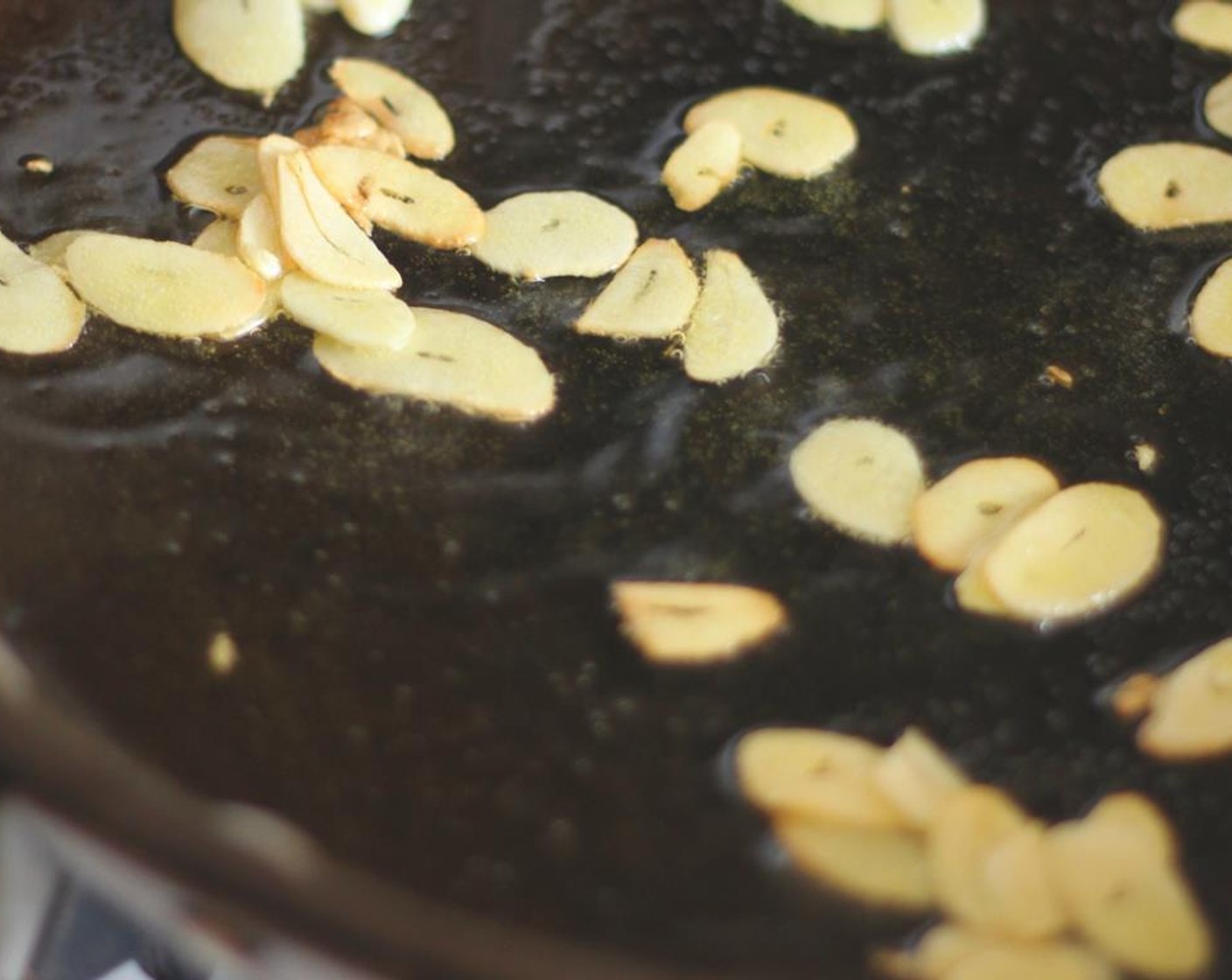 step 4 When the water is boiling and you've added the pasta, you can begin to cook the garlic. Heat Olive Oil (2 Tbsp) in a large pan, and cook the garlic until soft and slightly golden, about 4 minutes.