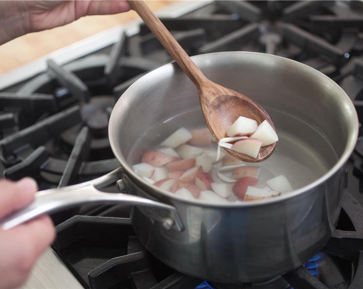 step 4 When water reaches a boil, add potatoes and cook for two minutes.