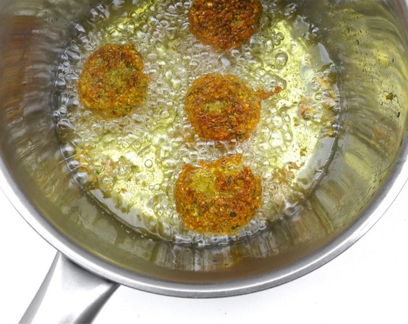 step 10 Transfer the fried falafels onto some kitchen paper to drain.