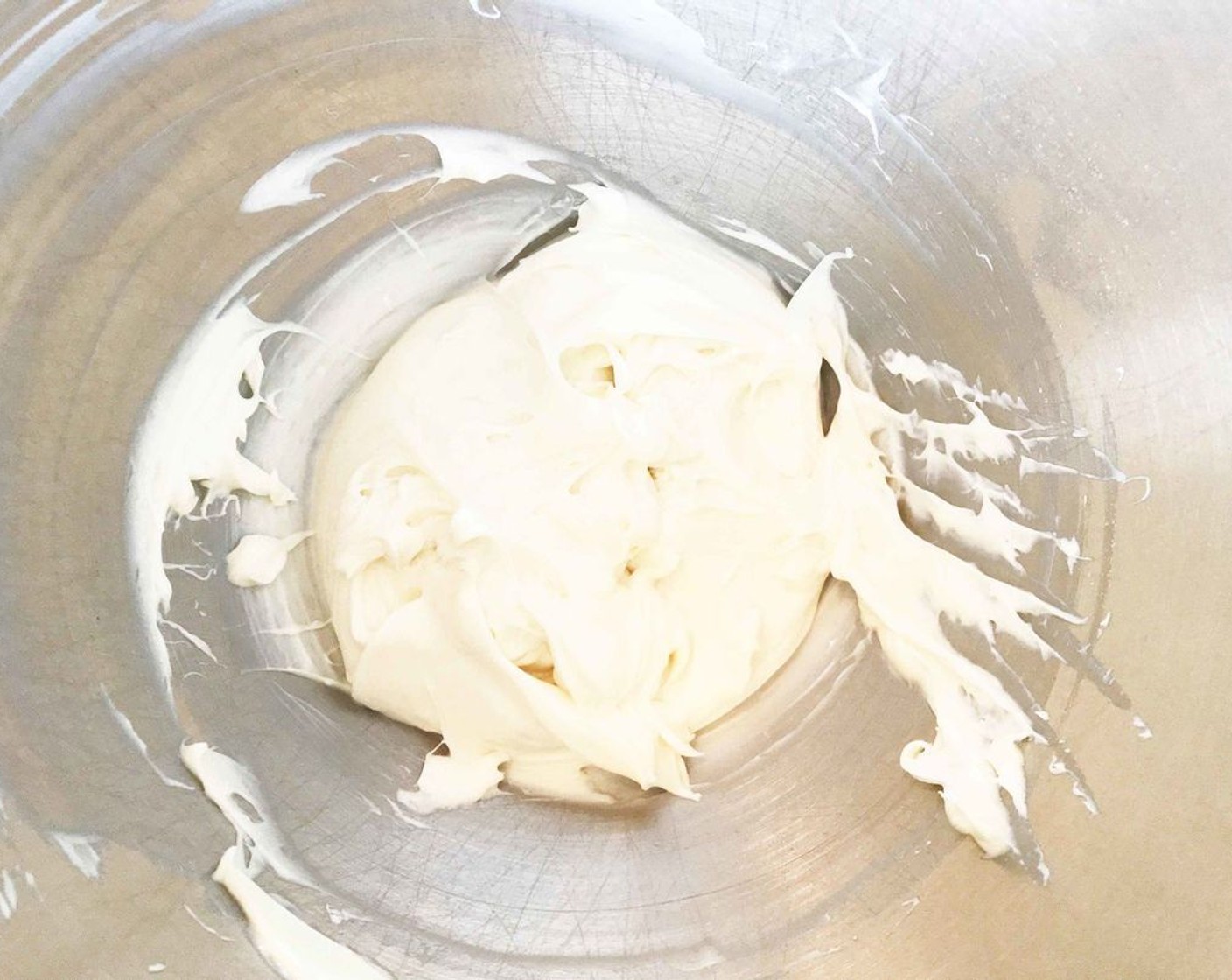 step 9 While the cake is cooling, beat together the Philadelphia Original Soft Cheese (1 cup), Powdered Confectioners Sugar (1/2 cup), Fat-Free Vanilla Greek Yogurt (1/3 cup), Swerve Confectioners Sugar Replacement (1/4 cup), and Vanilla Extract (1 tsp) until smooth and creamy.