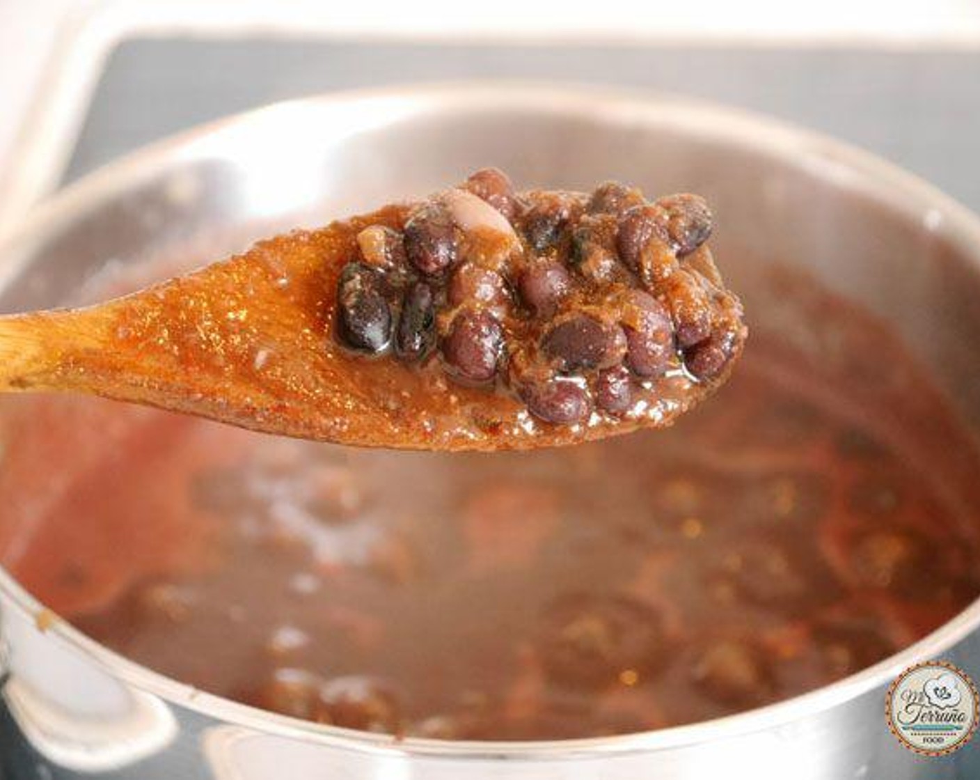 step 4 When the beans are half way cooked, add the tomato sauce to the beans with Salt (1/2 tsp), Roasted Cumin Powder (1/2 tsp), and Dried Oregano (1/2 tsp) leave to cook for approx 30 minutes or until the beans are soft. Stir occasionally to avoid the beans sticking to the pot.