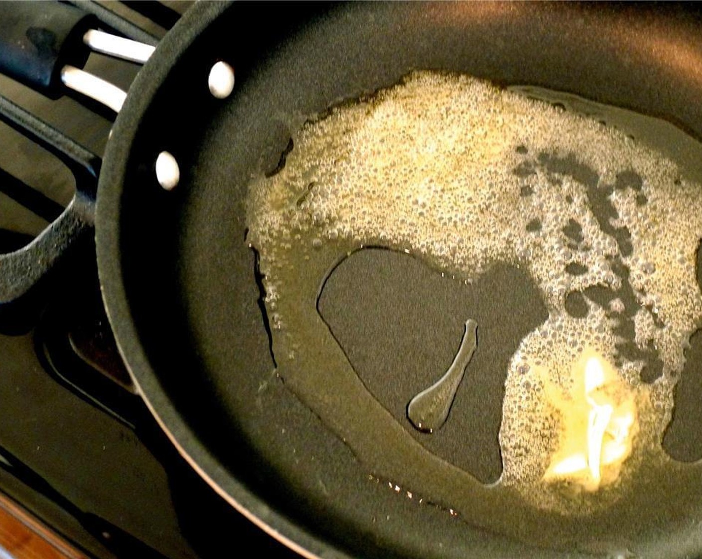 step 3 Melt Olive Oil (2 Tbsp) and Unsalted Butter (1 Tbsp) in a pan over medium-low heat.