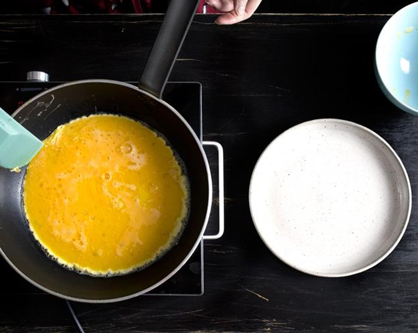 step 5 Add the beaten eggs.  Wait for 3 seconds without stirring anything, until the edges of the eggs starts to bubble up…