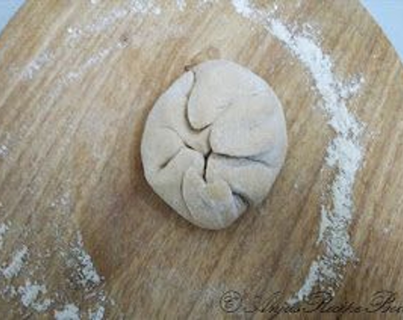 step 7 Now fold it from all sides and make it a ball, again roll this and make the roti or you can make 2 rotis and place the filling on one roti and cover it with the other roti. Place the second roti on top and seal the edges and the slightly roll it again.