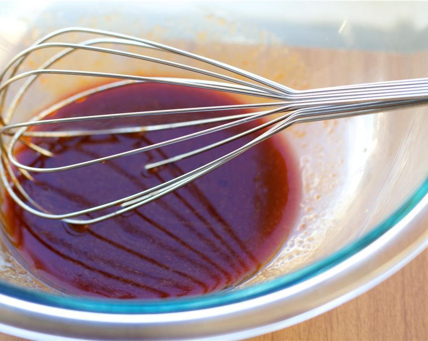 step 2 In a large bowl, whisk together the Sriracha (1/2 Tbsp), Sesame Oil (1/2 Tbsp), and Soy Sauce (2 Tbsp).