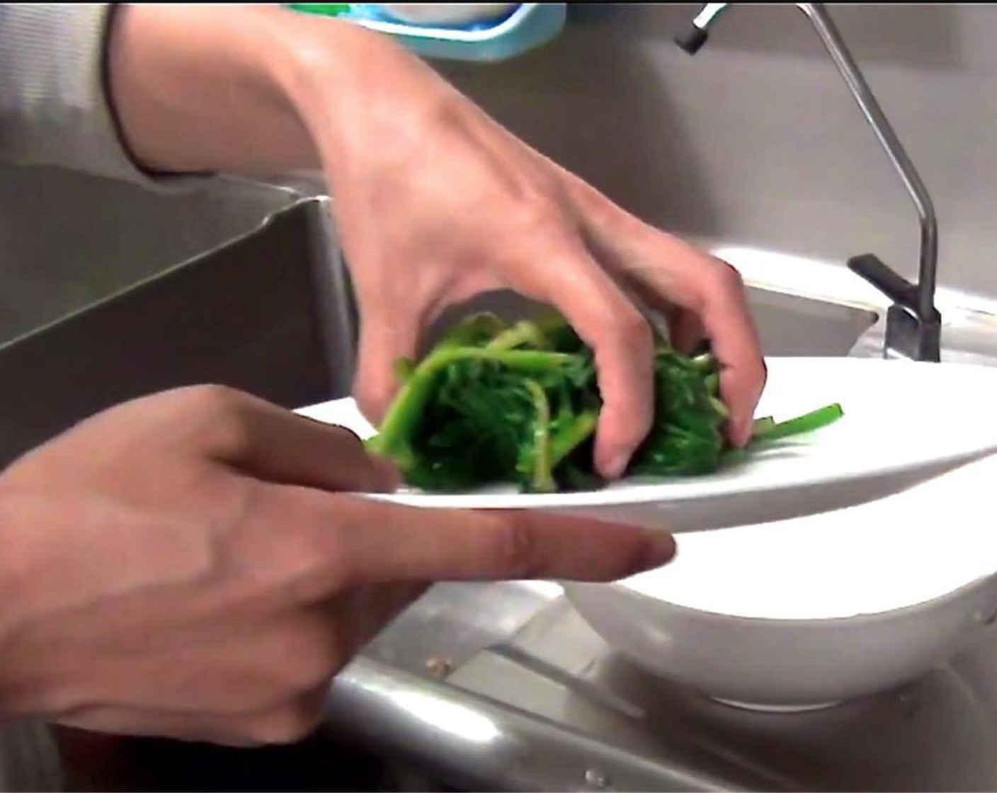 step 2 Rinse spinach in cold water, and squeeze to drain excess water.