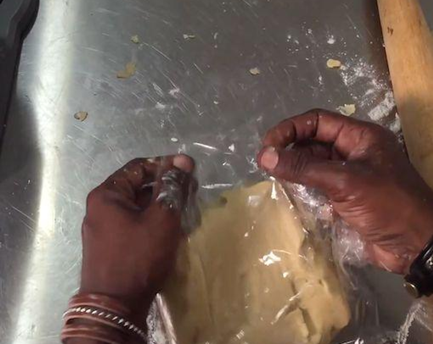 step 6 On a flat surface spread some flour lightly. Place the mixture on top of the flat surface and using your hands knead it just enough to pull the dough together. Cover it with plastic wrap and chill it for about 30 minutes in the fridge.