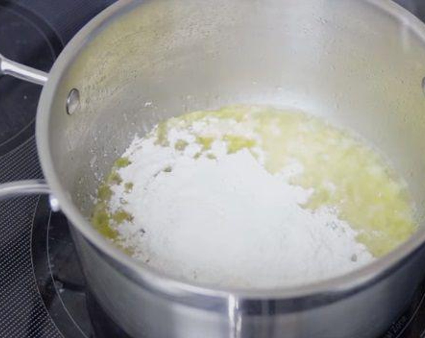 step 3 Whisk in the All-Purpose Flour (1/3 cup) and cook for a few minutes.