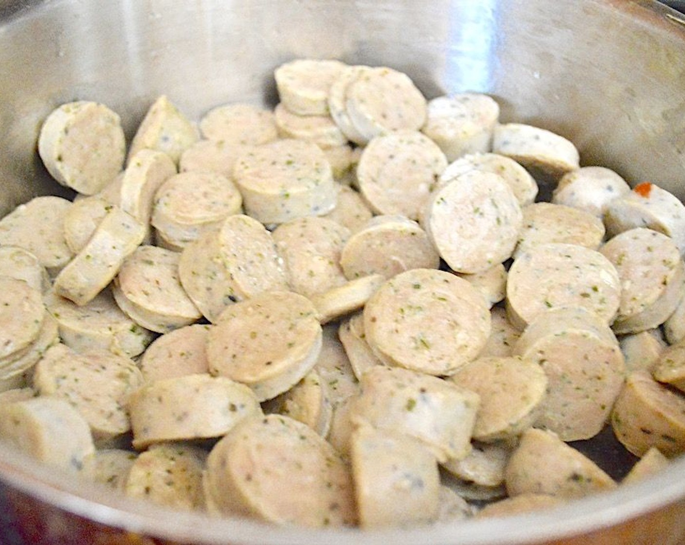 step 1 In a large skillet with deep sides, heat the Olive Oil (1 dash) over medium-high heat. Brown the Chicken Sausages (1.5 lb) for about 4-5 minutes.