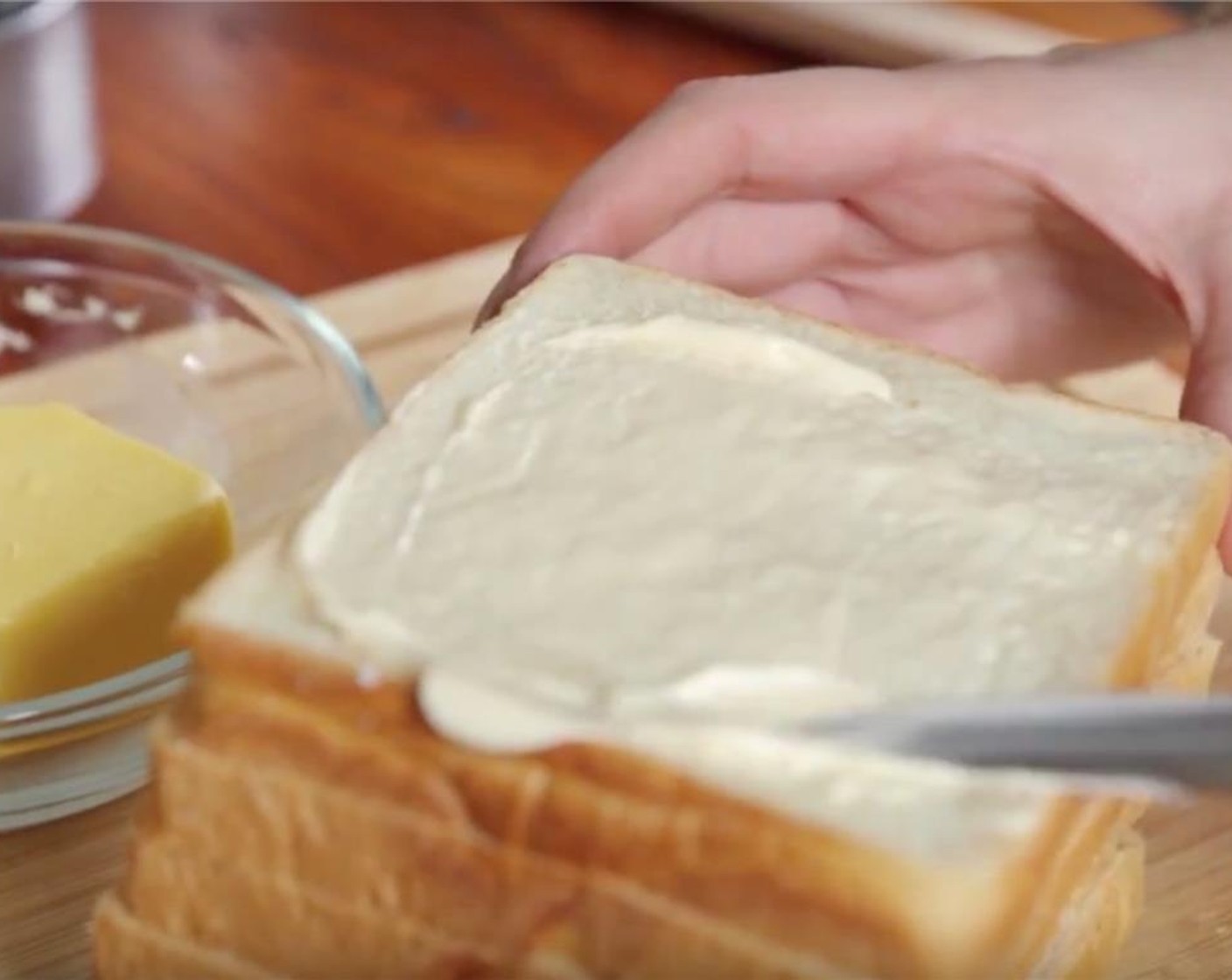 step 1 Place Sandwich Bread (2 slices) on a cutting board and spread Mayonnaise (2 Tbsp) over top side of each.