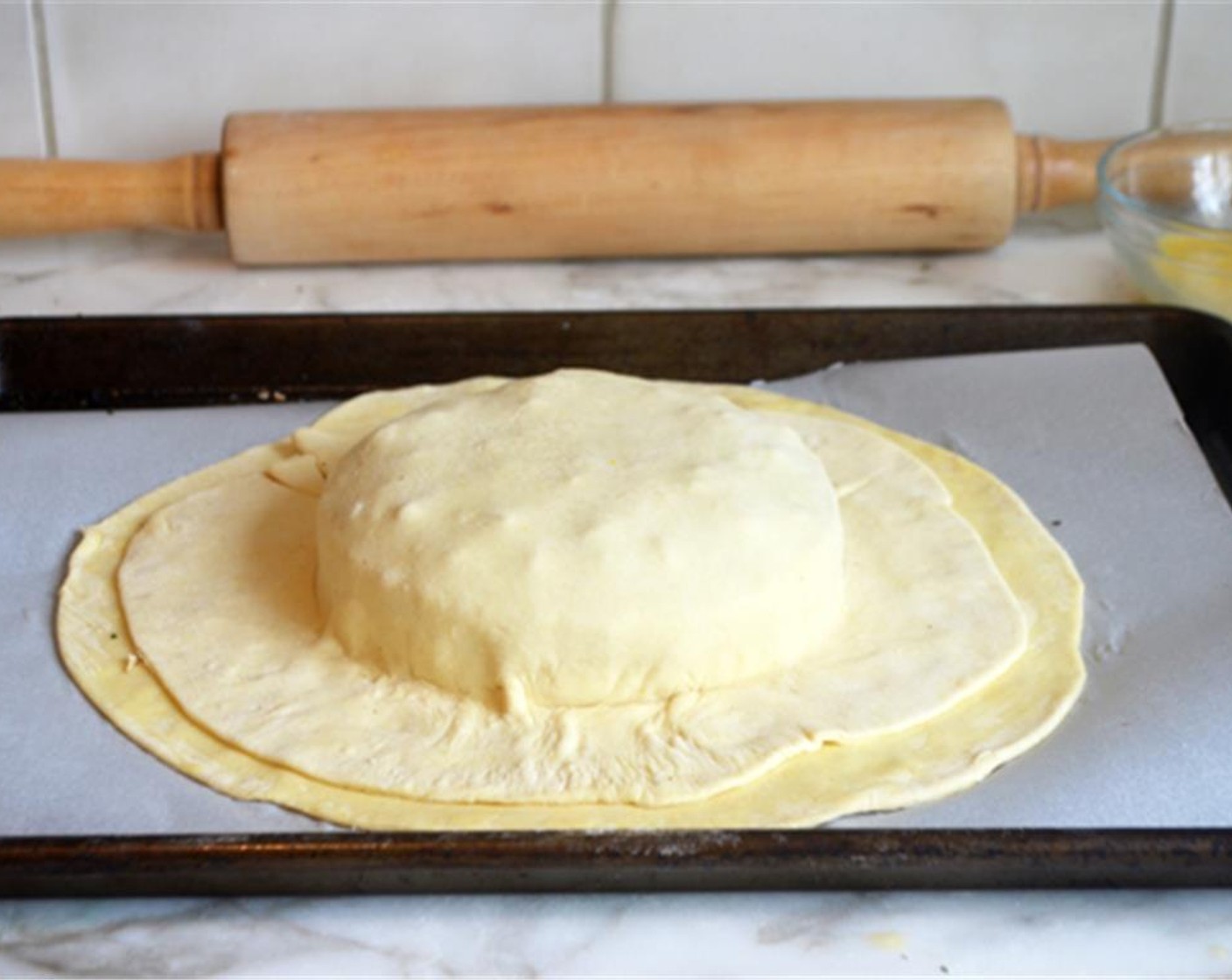 step 5 Place the second pastry circle on top; press the pastry directly against the cheese and bottom pastry.
