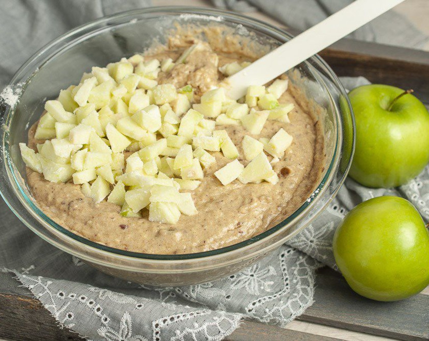 step 8 Whisk in dry ingredients until combined. Add diced apples, shaking off any excess flour as you add them. Stir to evenly distribute.