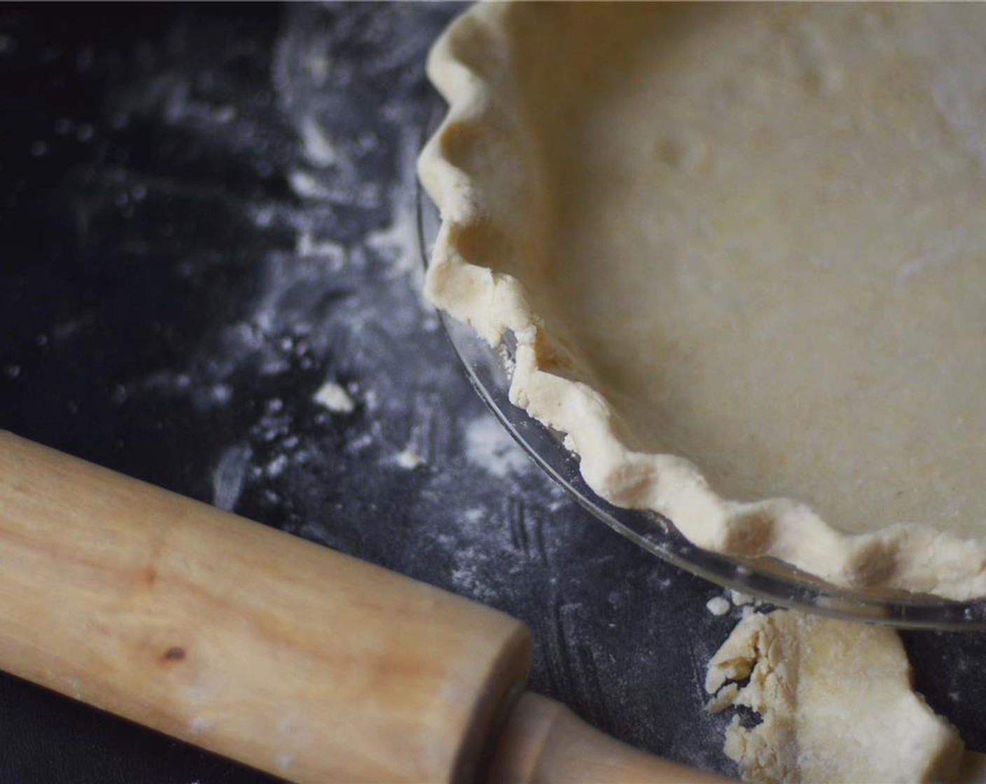 step 8 There will be excess dough hanging over edges. If needed, trim off anything beyond ½ inch or so. Crimp edges with thumb and pointer fingers. Place pie in the freezer for about 15 minutes. Preheat oven to 400 degrees F (200 degrees C).