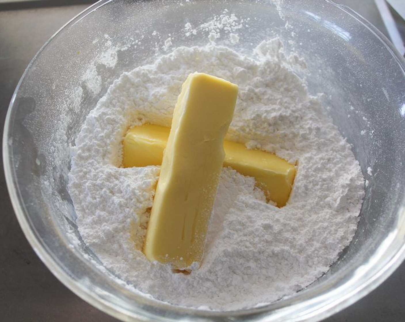 step 7 While the cupcakes are cooling, in a large bowl with a hand mixer, beat the Powdered Confectioners Sugar (8 cups) on low to break up large clumps. On low to medium speed, combine the Butter (2 cups) and powdered sugar until smooth and creamy.