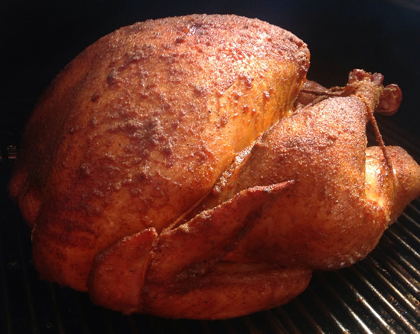 step 13 When the timer goes off, rotate the turkey on the rack to ensure it is cooking evenly on all sides. Never flip the turkey. It stays on the back, breast up, the entire cook.