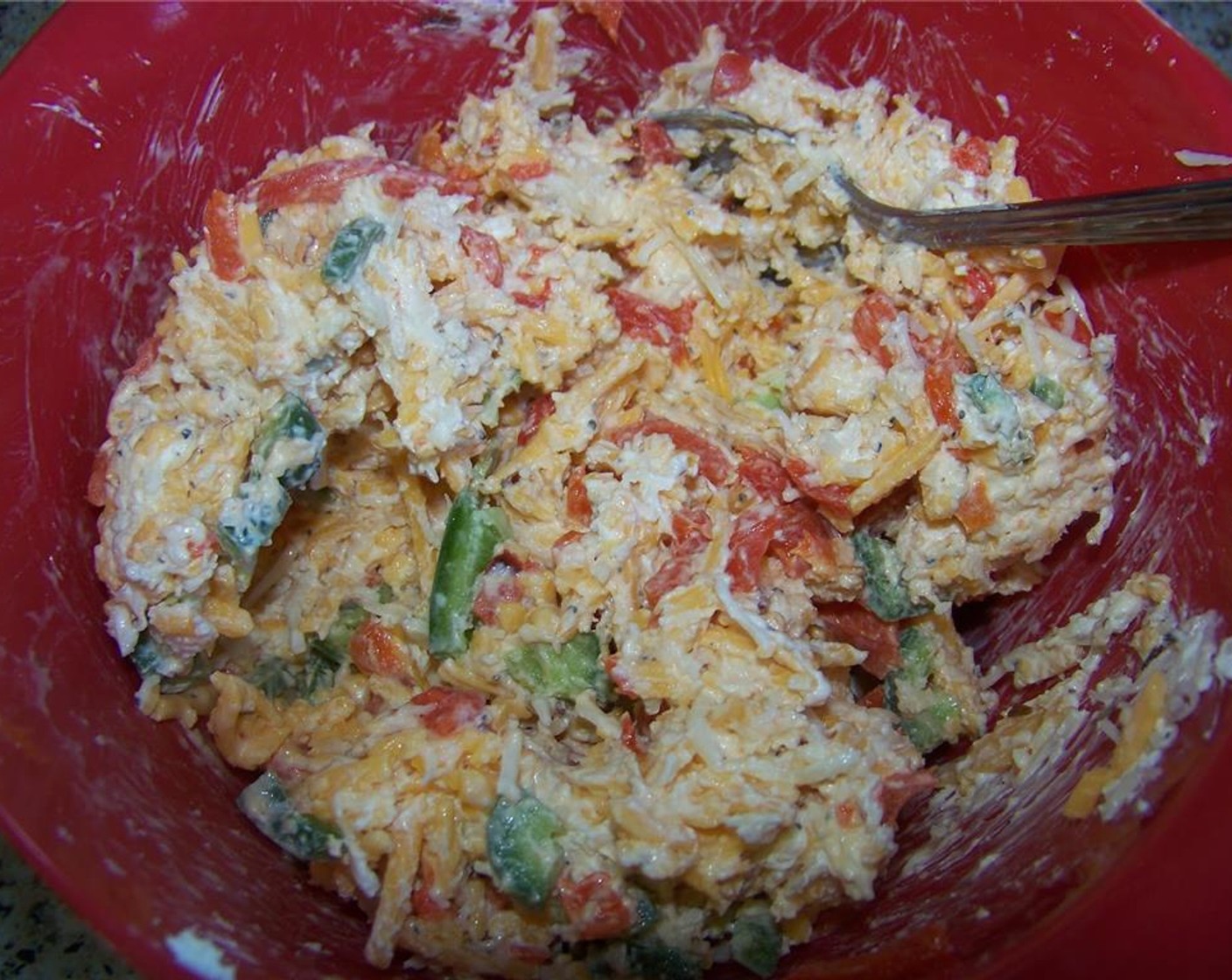step 3 In a medium bowl, mix together the sharp cheddar cheese, Mozzarella Cheese (1/2 cup), Cream Cheese (1/3 cup), McCormick® Garlic Powder (1/2 tsp), Ground Black Pepper (1/2 tsp), Crushed Red Pepper Flakes (to taste), Jalapeño Pepper and Pimiento Peppers (2 Tbsp)
