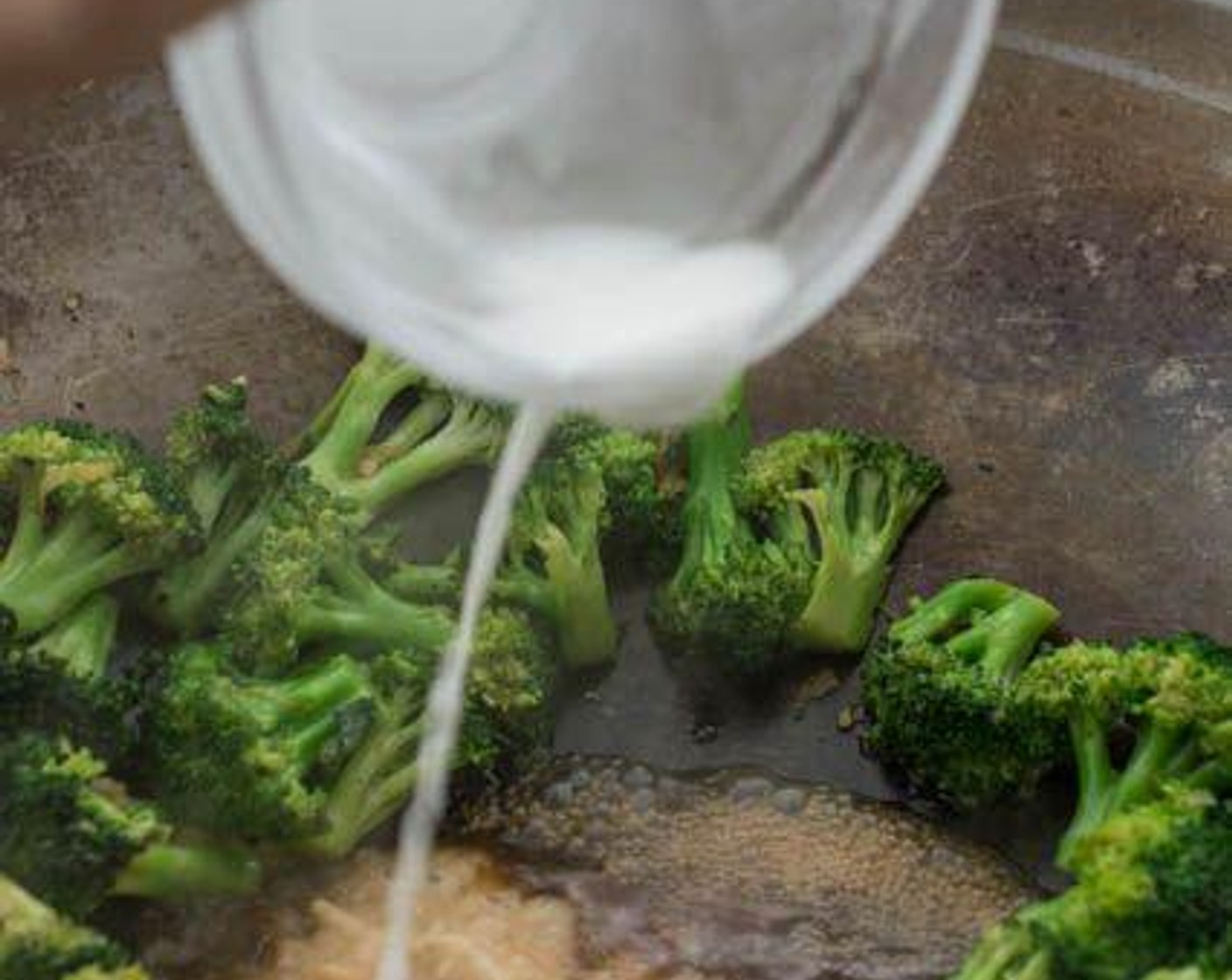 step 6 Stir in the sauce, then continue to stir-fry the broccoli in the sauce for another minute or until they reach your desired doneness, the longer you leave the broccoli to simmer in the sauce, the softer they become. Push the broccoli to the sides of the wok, give your cornstarch mixture a quick stir in the bowl, then pour it into the sauce.