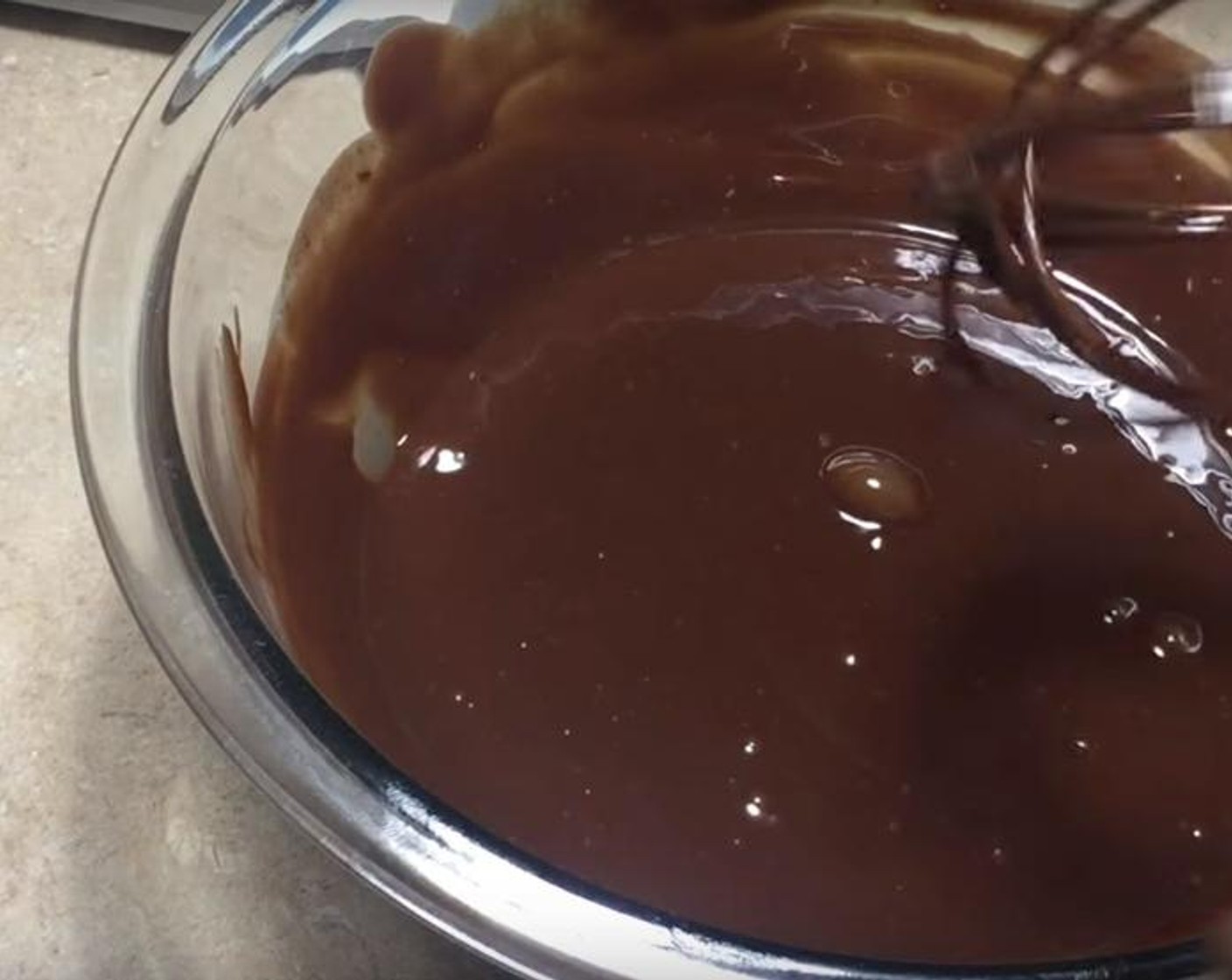 step 2 For the chocolate ganache: in a bowl, put Chocolate Chips (2/3 cup). Add Heavy Cream (1/2 cup). Whisk them together. Heat the mix on the stove on medium heat until it begins to bowl.