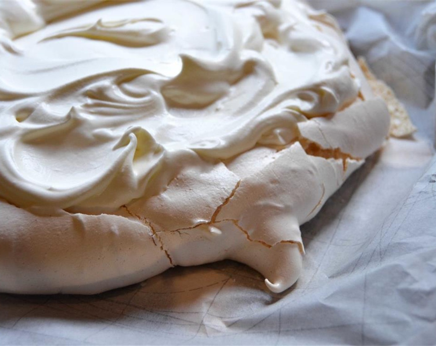 step 10 Beat the Fresh Cream (1 2/3 cups) and Caster Sugar (1 Tbsp) until stiff and peaky. Carefully transfer the meringue base on to your chosen platter. Using a spatula, layer the cream over the top of the cooled pavlova, creating waves and peaks.