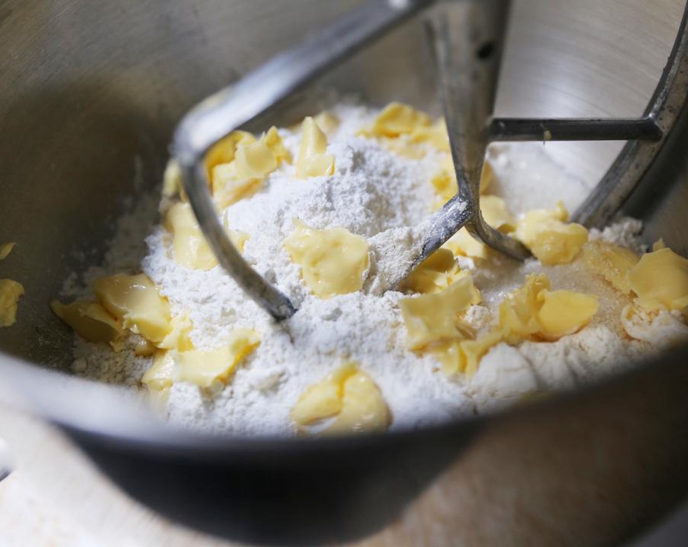 step 3 Place the All-Purpose Flour (3 1/2 cups),  Granulated Sugar (1/3 cup), Baking Powder (2 Tbsp) and Salt (1/2 tsp) in the bowl of a stand mixer fitted with the paddle attachment. Add the cubed Butter (1/3 cup).