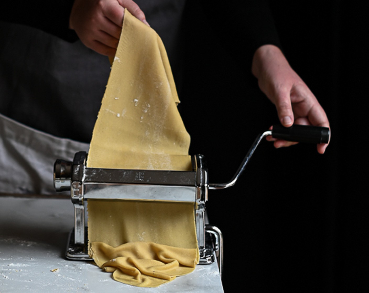 step 6 Halve the dough and keep one half wrapped in clingfilm to prevent it from drying out. Using a pasta machine or a rolling pin, roll out half the dough until you have a thin strip about 8 cm wide.