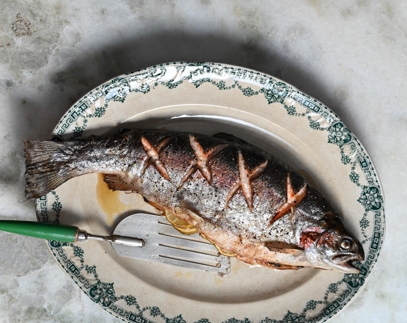 step 4 Season the trout’s skin with more salt and pepper and roast the fish in the oven for 20-25 minutes or until the skin is crispy and the flesh is flaking.
