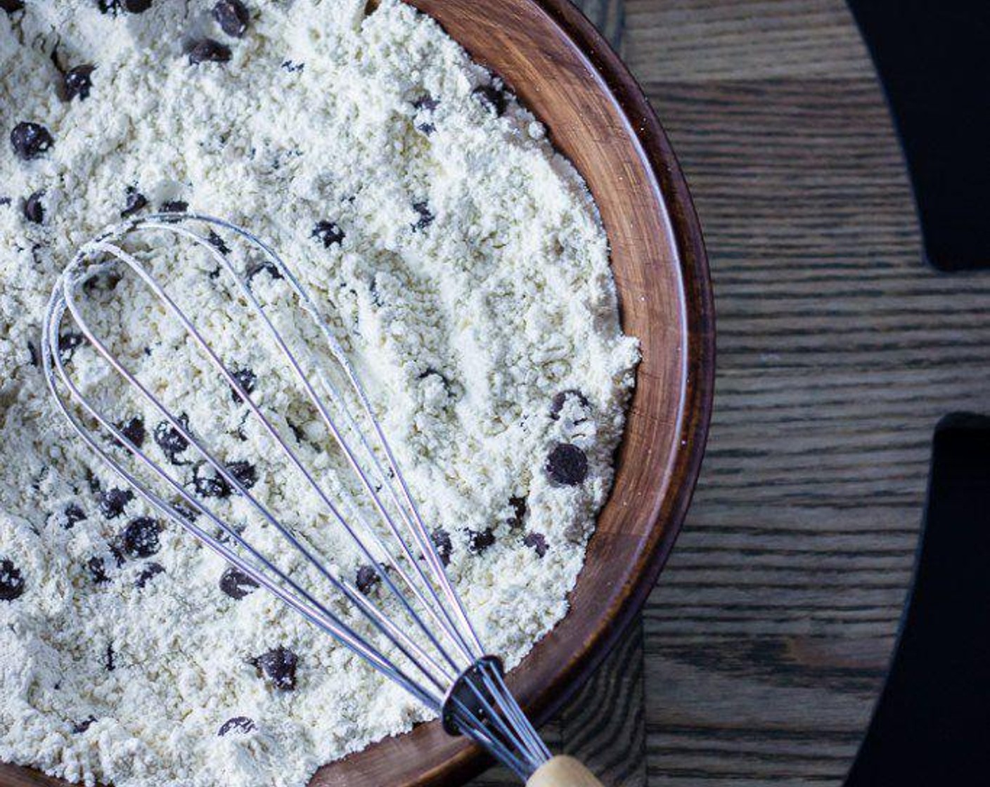 step 1 In a bowl, whisk All-Purpose Flour (2 cups), Baking Soda (3/4 tsp), Baking Powder (1 tsp), Fine Salt (1/2 tsp). Add Vegan Dark Chocolate Chips (3/4 cup) to the bowl and toss to coat.