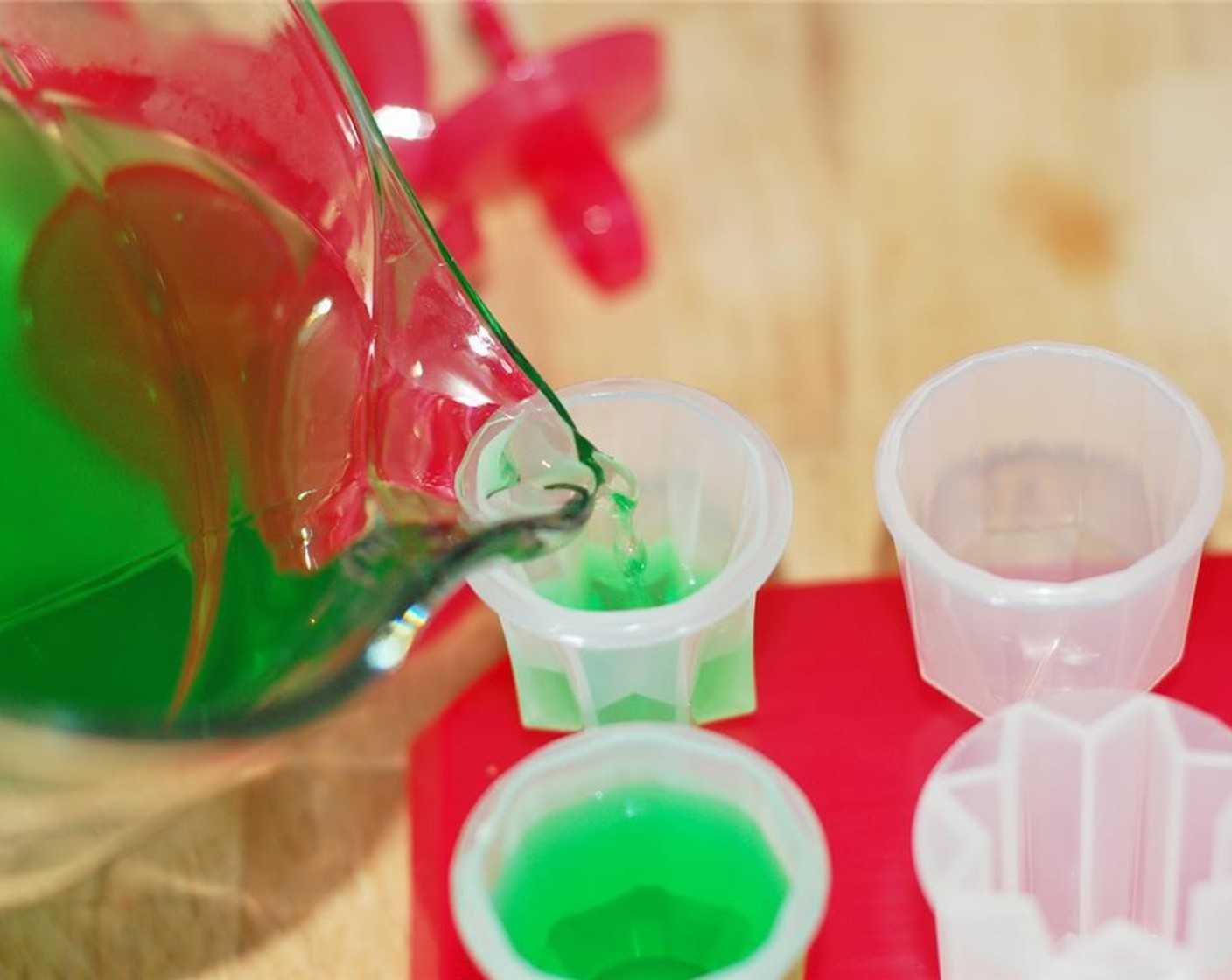 step 3 Next pour the Jello mix into popsicle molds and freeze for 4-6 hours or until firm.