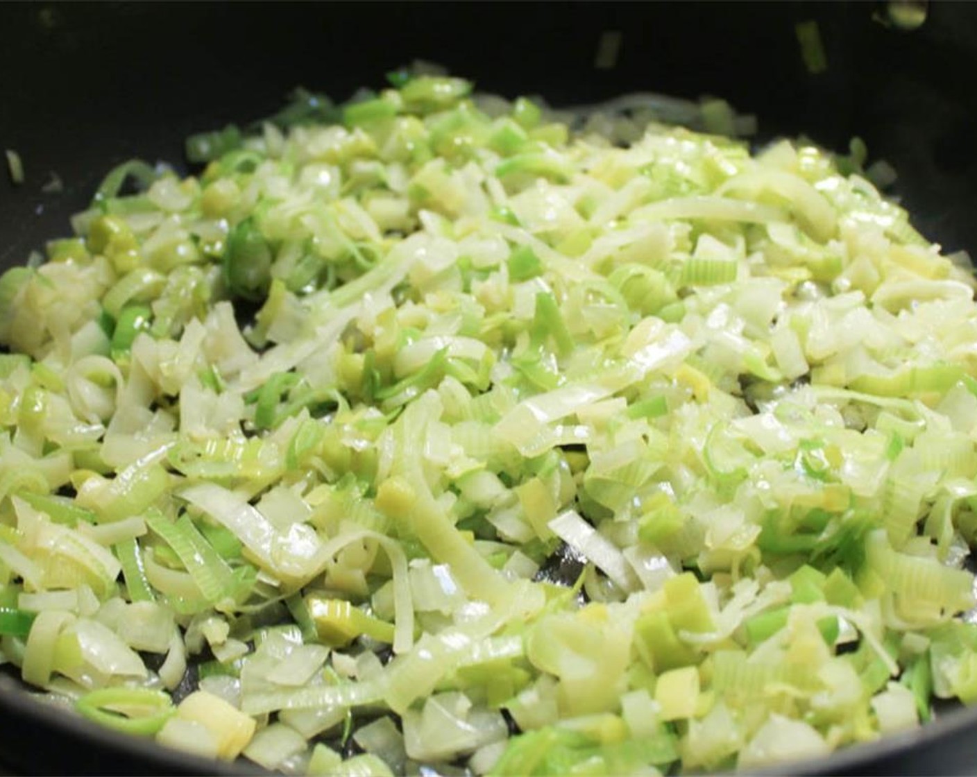 step 10 Heat the Olive Oil (1 1/2 Tbsp) in a large sauté pan over medium heat. When hot, add the leeks, onions and garlic and cook until soft, about 5 minutes.