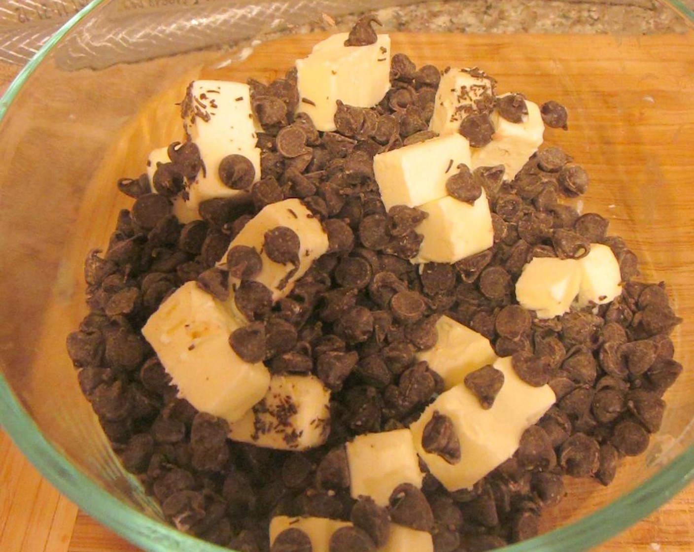 step 3 In a large bowl, microwave Unsalted Butter (1/3 cup) and Semi-Sweet Chocolate Chips (2 cups) in 30-second increments, stirring each time, until melted and smooth, about 2 minutes.