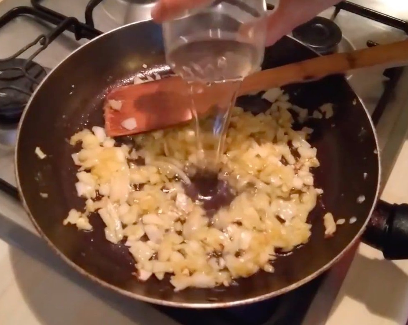 step 7 Add White Wine (1/3 cup), Water (3/4 cup), and Fish Stock (to taste) and cook for a few minutes more in medium heat.