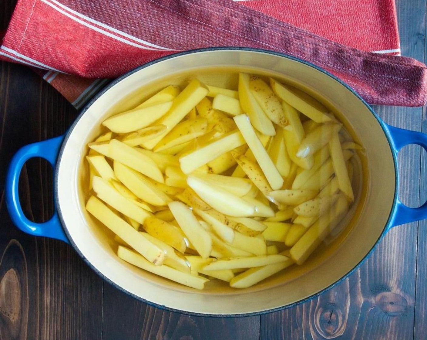 step 4 Add the Peanut Oil (as needed) to a medium dutch oven. Put the potatoes into the cold oil.