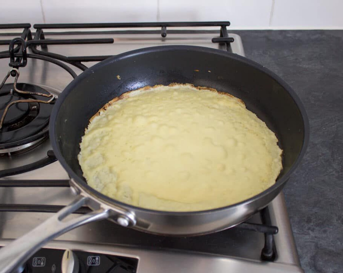 step 7 Allow to cook for a few minutes. If you’re pan is hot enough, it will start to bubble when it is ready to be flipped. But just keep an eye on it by lifting up an edge to check if it’s golden brown.