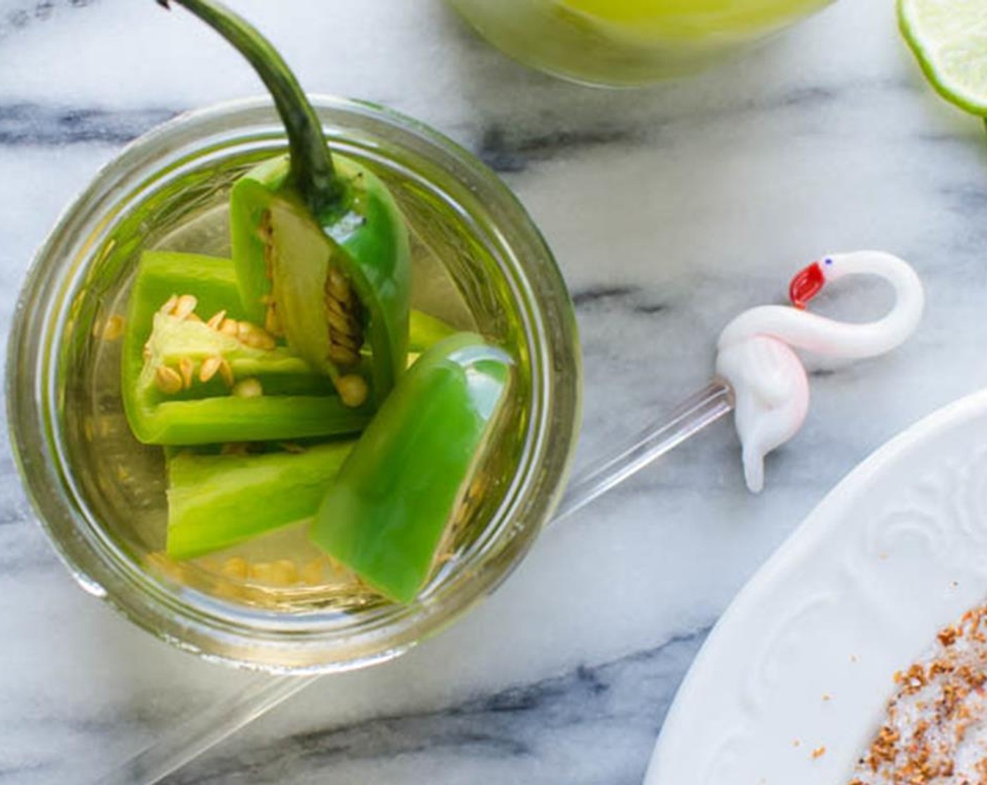 step 6 In a glass jar, add the jalapeno and cover with Reposado Tequila (1 1/2 cups). Cover and refrigerate until chilled, around 2-4 hours (the longer it steeps, the spicier it gets).