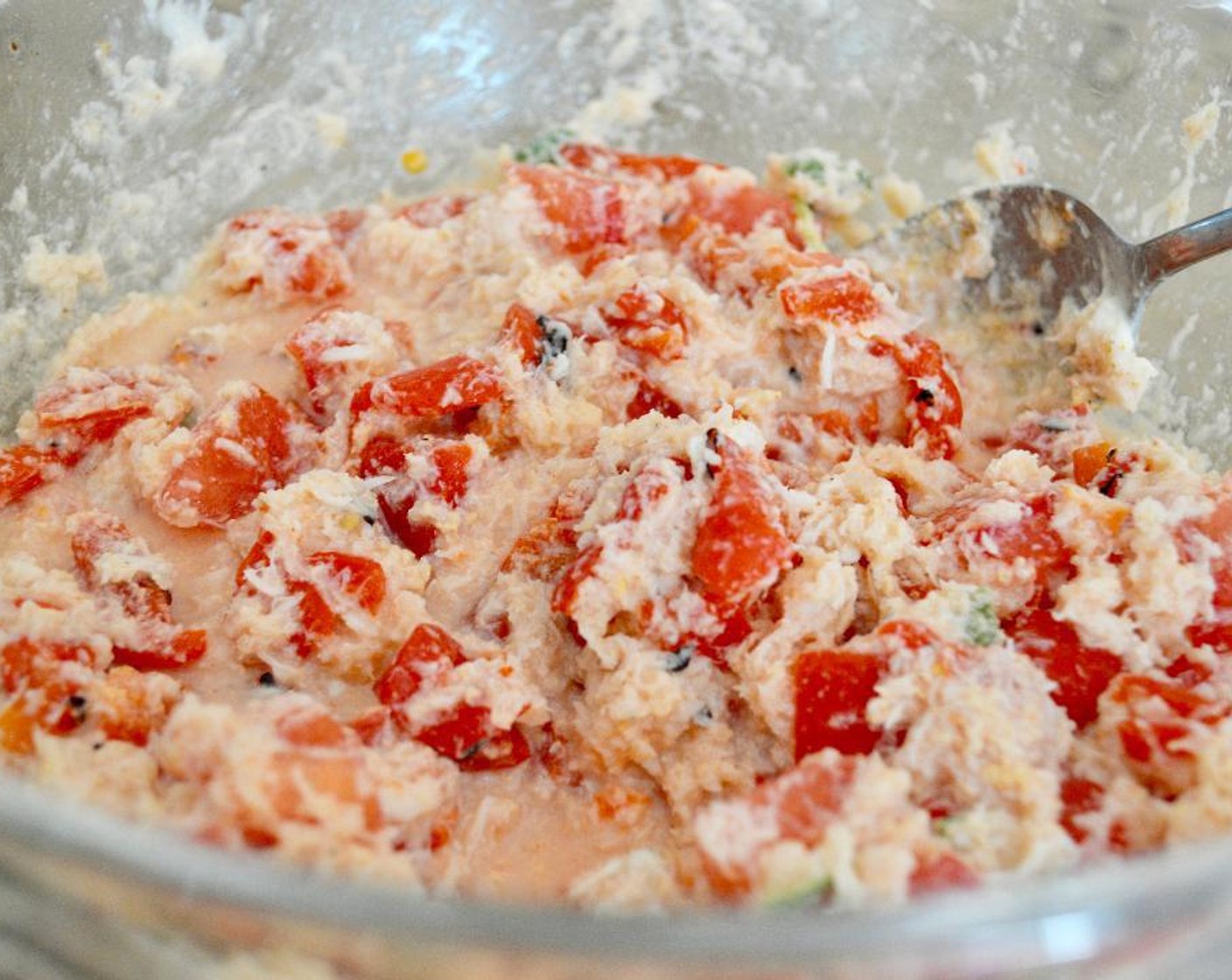 step 5 While they toast, stir the Fresh Crab Meat (1 lb), Jarred Roasted Red Peppers (1 jar), Tomato (1), Fresh Basil Leaves (6), Crème Fraîche (1/3 cup), Old Bay® Seasoning (1/2 tsp), and Salt (1 pinch) together in a bowl thoroughly.