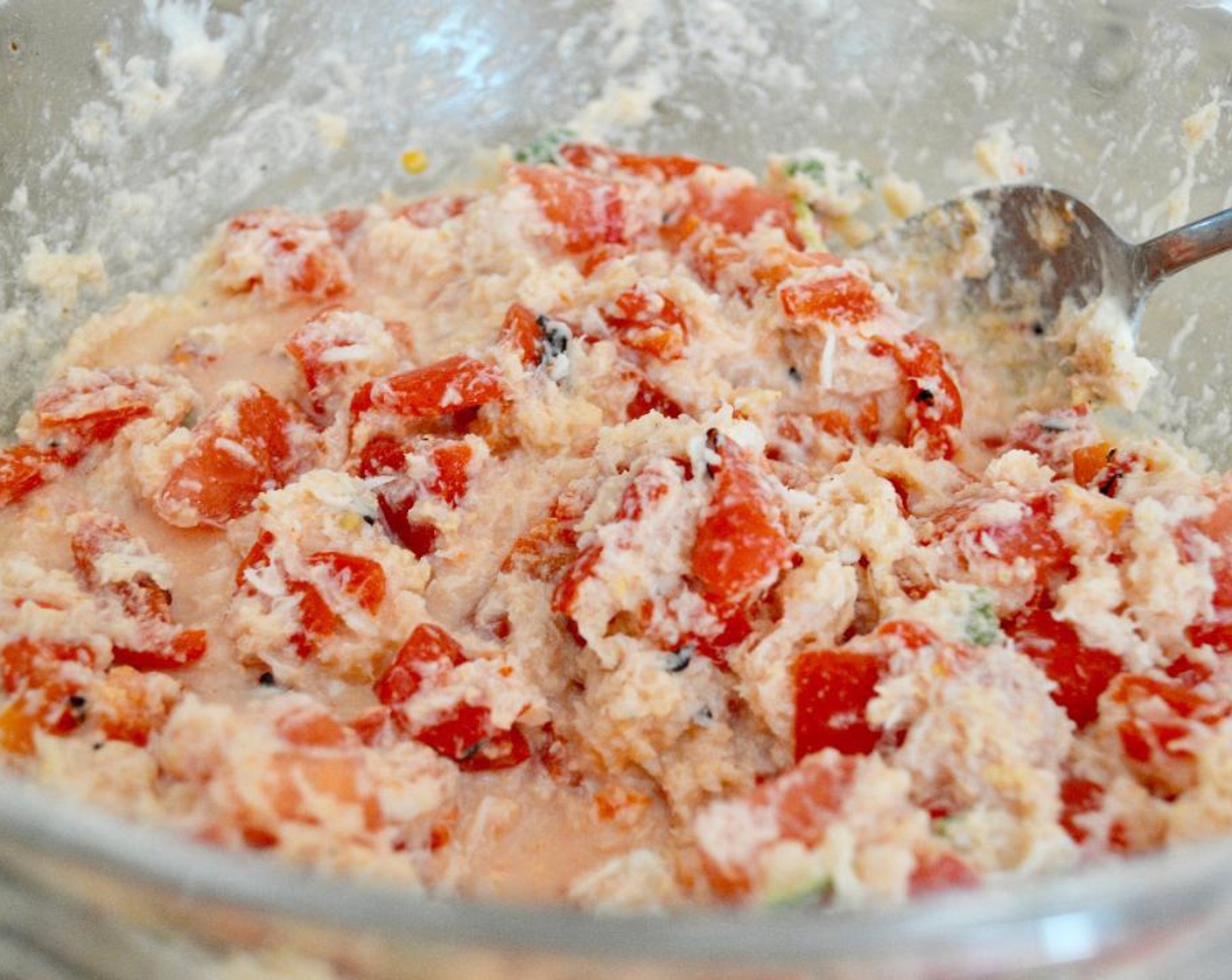 step 5 While they toast, stir the Fresh Crab Meat (1 lb), Jarred Roasted Red Peppers (1 jar), Tomato (1), Fresh Basil Leaves (6), Crème Fraîche (1/3 cup), Old Bay® Seasoning (1/2 tsp), and Salt (1 pinch) together in a bowl thoroughly.