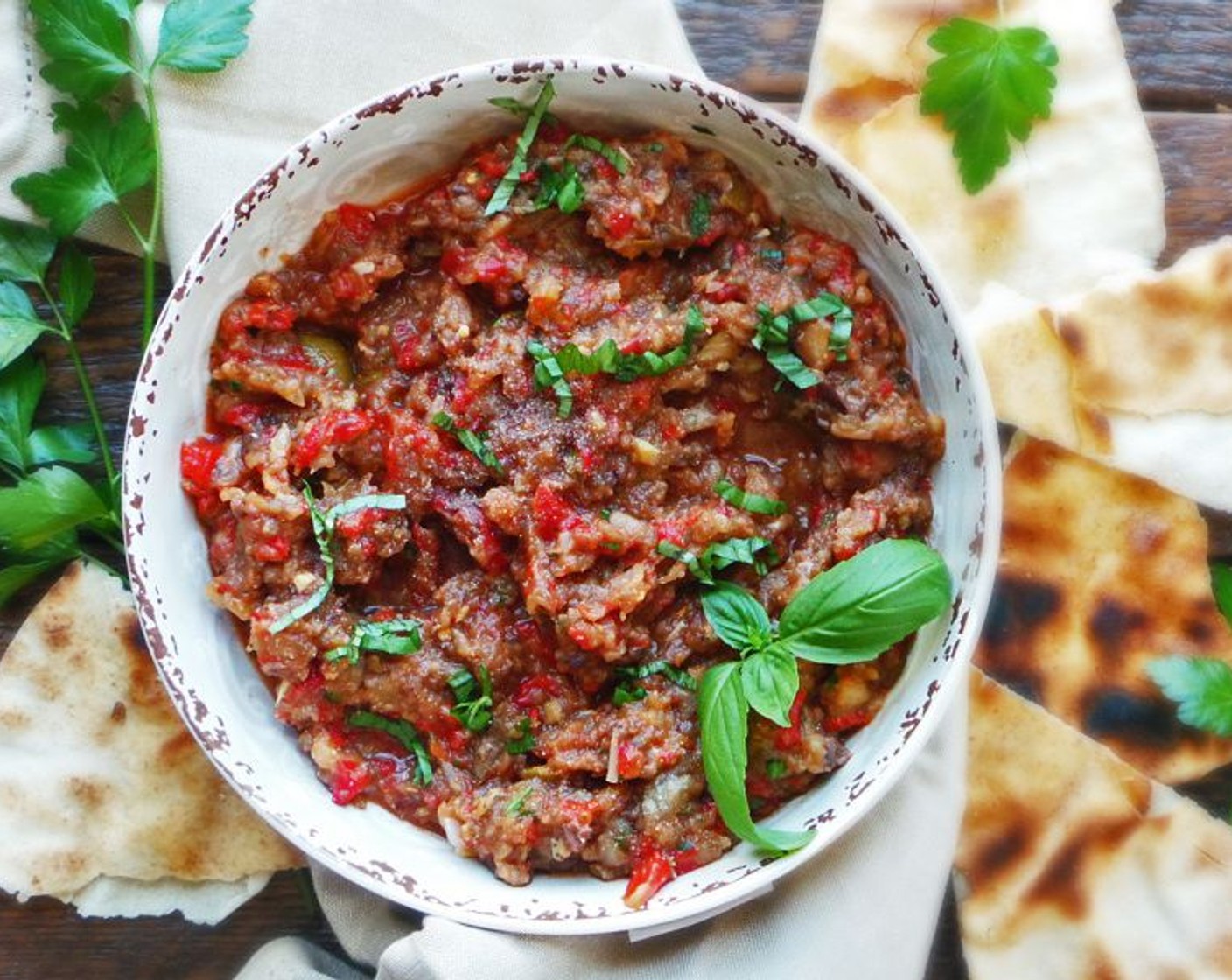 step 8 Top with Fresh Basil Leaves (to taste) and serve with grilled Pita Bread (to taste). Enjoy!