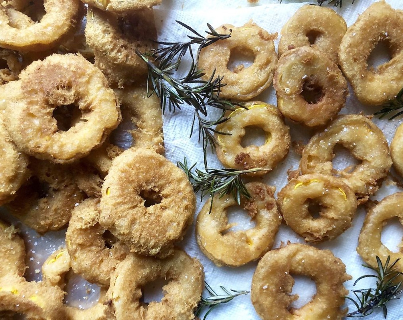 step 7 When you’re done frying all the rings, drop some Fresh Rosemary (to taste) in the oil for about a minute on each side until it just starts to slightly brown. Remove the rosemary.