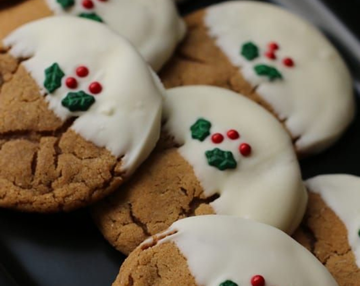 step 9 Dip each cookie half-way into melted white chocolate and place back on parchment paper to dry. While the white chocolate is still “melty”, decorate with Holiday Sprinkles (to taste).