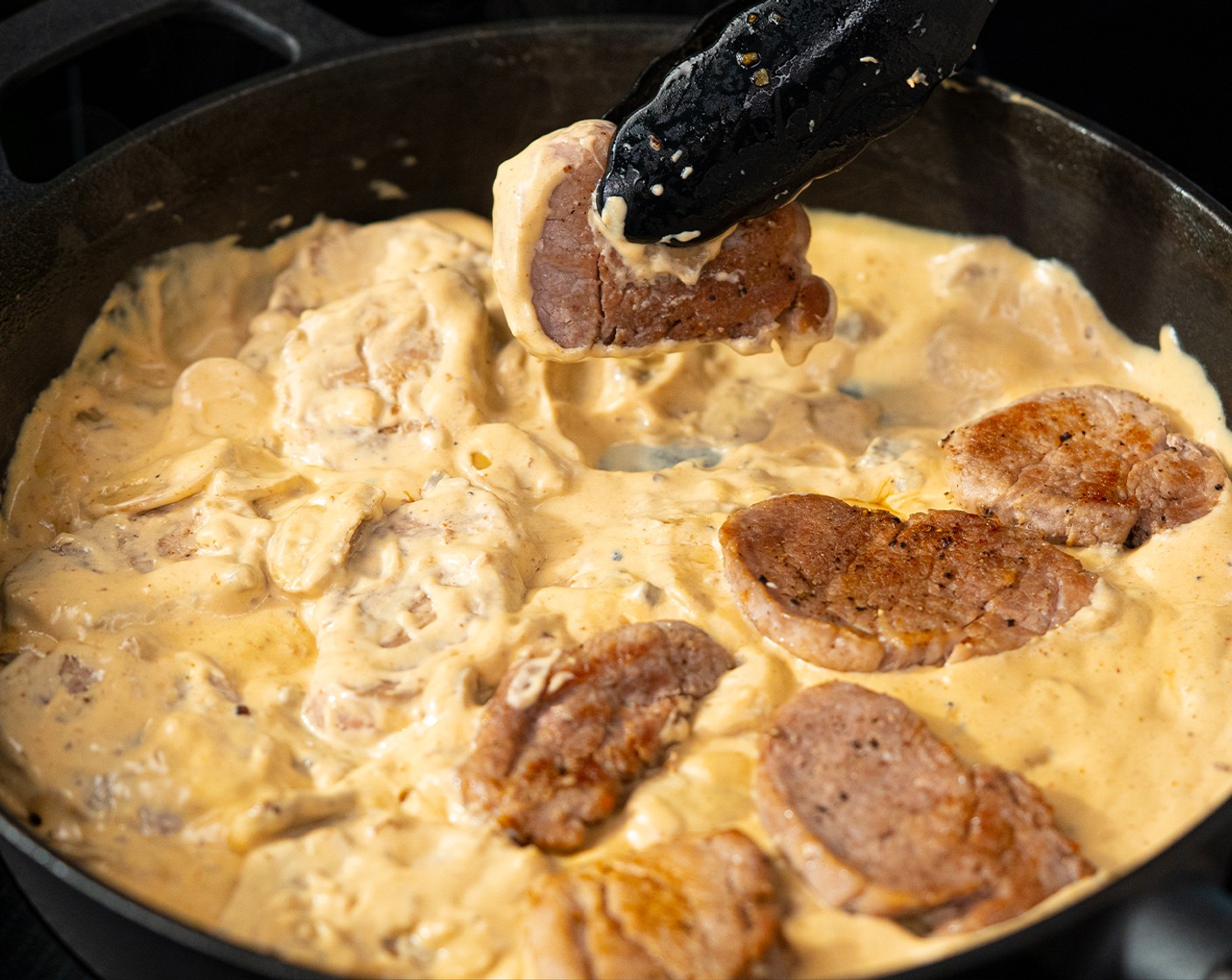 step 5 Turn the heat to medium, then transfer the pork back to the pan and simmer for 3 more minutes.