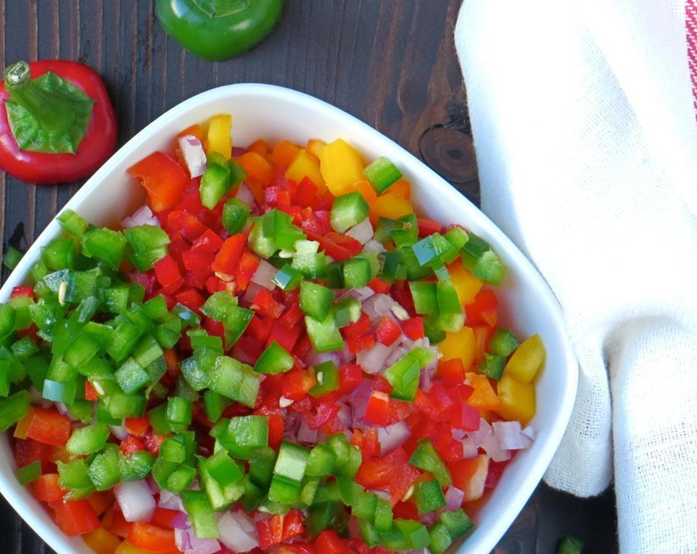 step 3 Cut the Red Bell Pepper (1/4), Orange Bell Pepper (1), and Yellow Bell Pepper (1) into 1/4-inch dices.