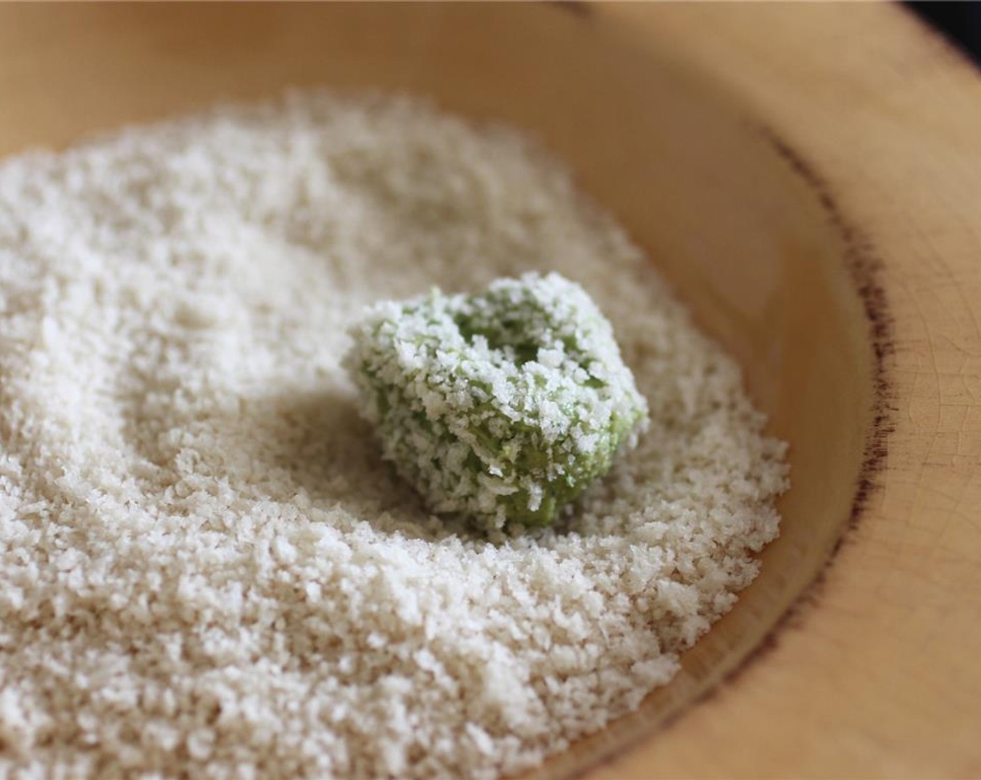 step 4 Roll the mixture into small balls in the palm of your hand. Your hands will get very full of cheese mixture! Roll each ball in Panko Breadcrumbs (1/2 cup), this will make them less sticky and easier to work with.