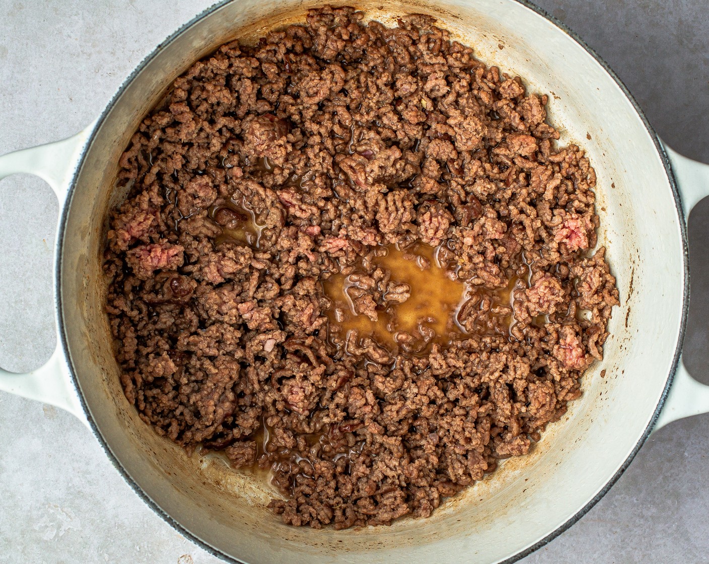 step 3 Carefully dry the pot with a paper towel, add Canola Oil (1 1/2 Tbsp), and heat to medium. Add in 80/20 Lean Ground Beef (1 lb) and stir to break into smaller crumbles. Cook until the meat is no longer pink.