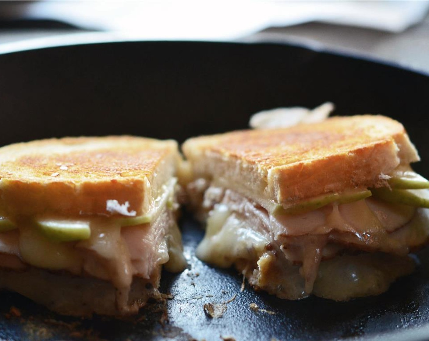 step 7 Once the cheese is melty and the bread is toasted, slice the sandwich in half.