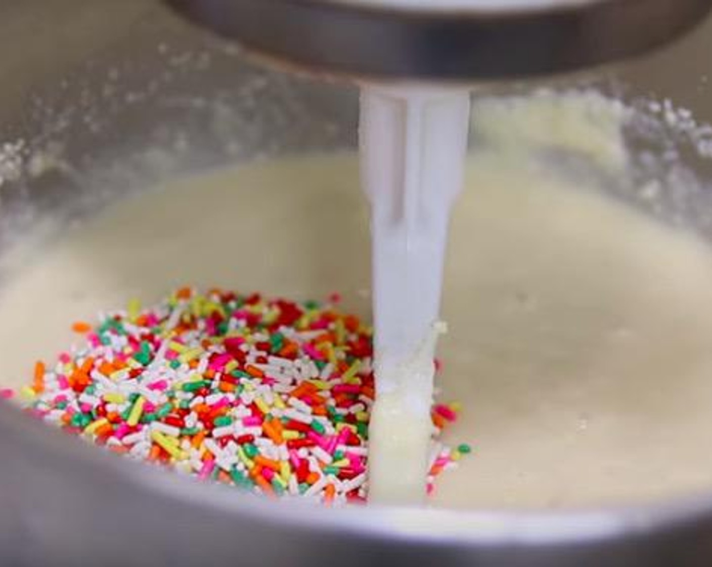 step 5 Add in milk mixture and mix on medium low until just combined. Stir in the Sprinkles (1/3 cup).