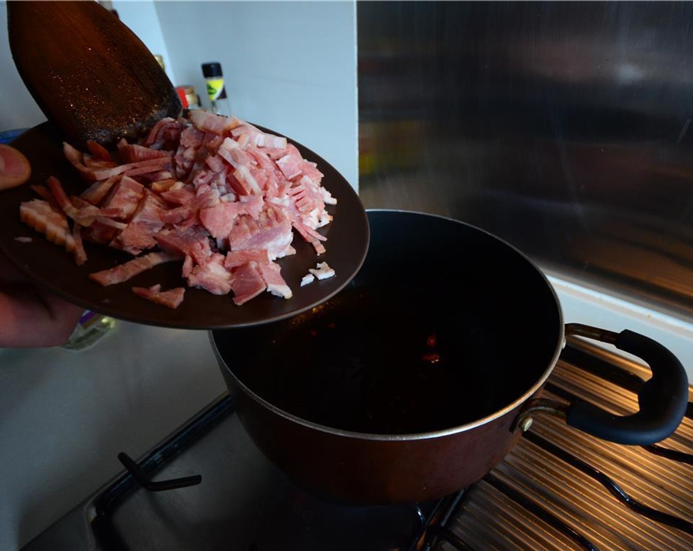 step 4 Render the bacon in a large pot and fry on medium-high heat until crispy. Set some aside for sprinkling.