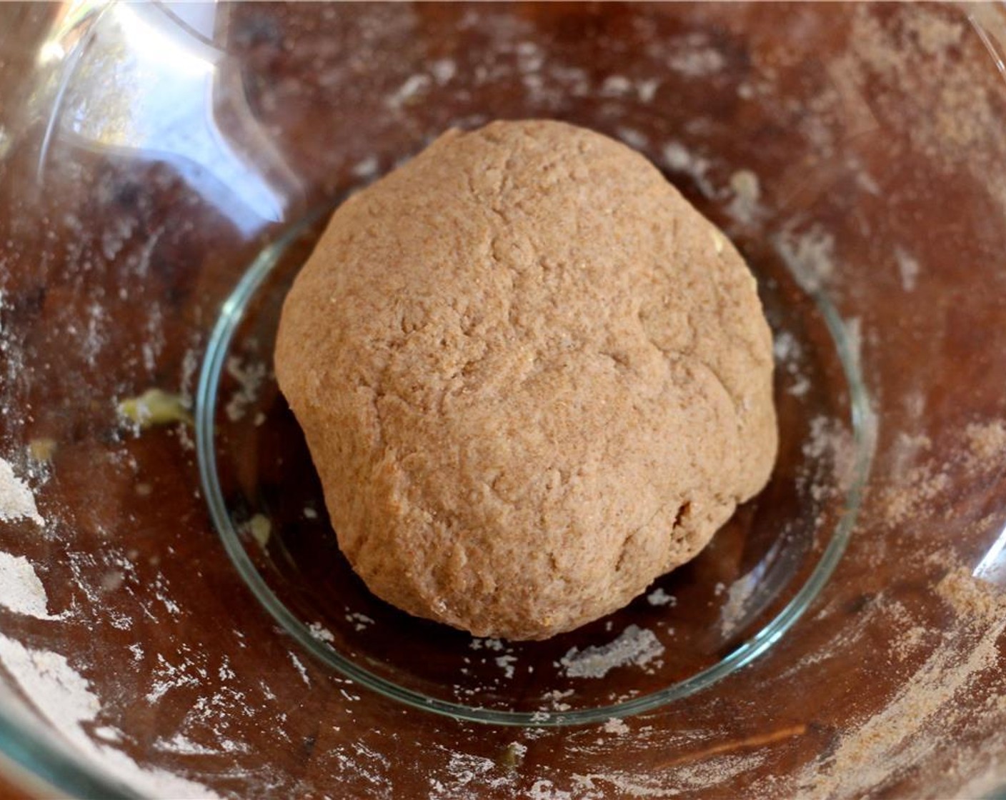 step 8 For the roti, in a small bowl, mix together the Whole Wheat Flour (2 cups), Water (1 cup), and Salt (1 tsp) using one clean hand. It should form a fairly moist dough. Knead until smooth and form into a ball.  Cover with a damp towel or paper towel. Set aside for 10 minutes.
