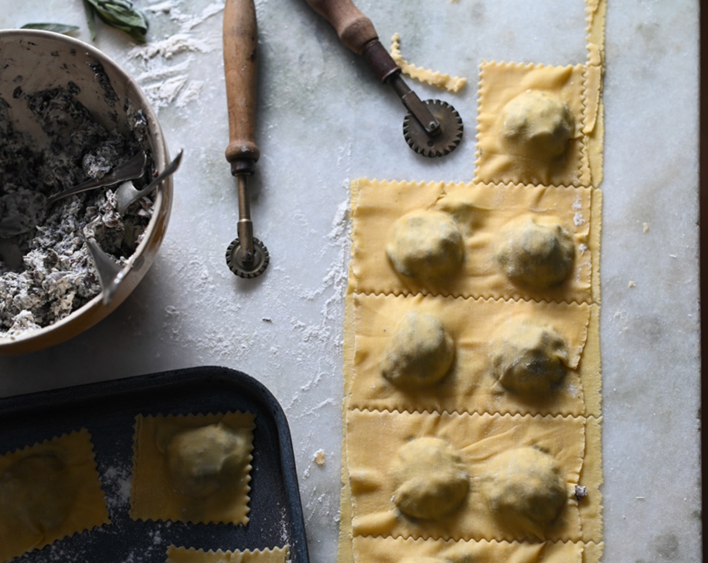 step 12 Seal the edges of the ravioli pockets with a brush of water and if desired, use a ravioli cutter to press out small pockets. Set the cut ravioli on a lined baking sheet sprinkled with semolina until ready to cook.