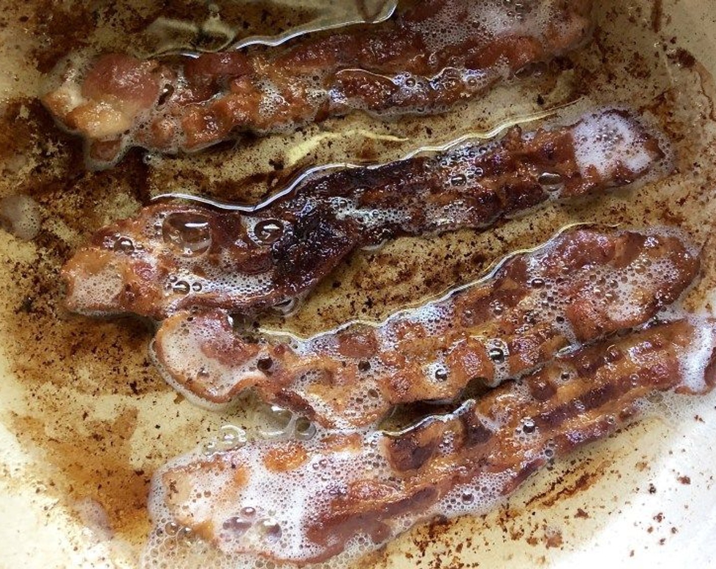 step 1 In a Dutch oven of at least 5-quart capacity, cook Bacon (4 slices) over medium-low heat for 7 to 8 minutes or until crisp, turning often. Transfer to a plate lined with paper towels, keeping the drippings in the pot. Once the bacon is cooled, break into small pieces to be used as a garnish when serving.